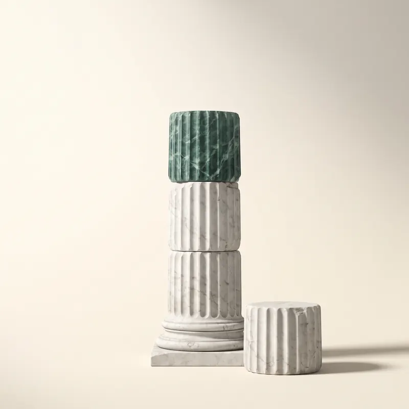 A classical column being raised: three fluted marble drums, the top one in green marble, a fourth waiting beside them.
